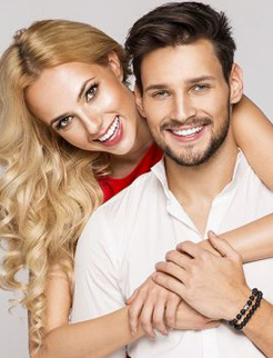 smiling couple after cosmetic dentistry