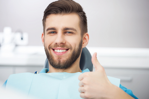 man smiling in dentist chair