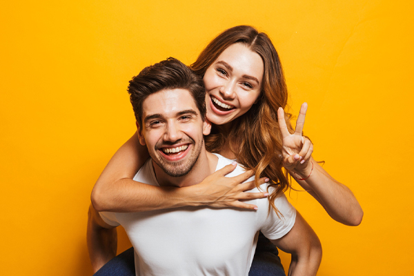 couple smiling after getting cosmetic dentistry