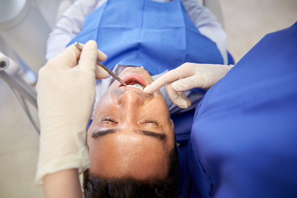 patient being examed by dentist