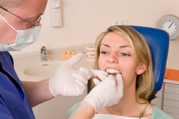 woman getting aligner put in